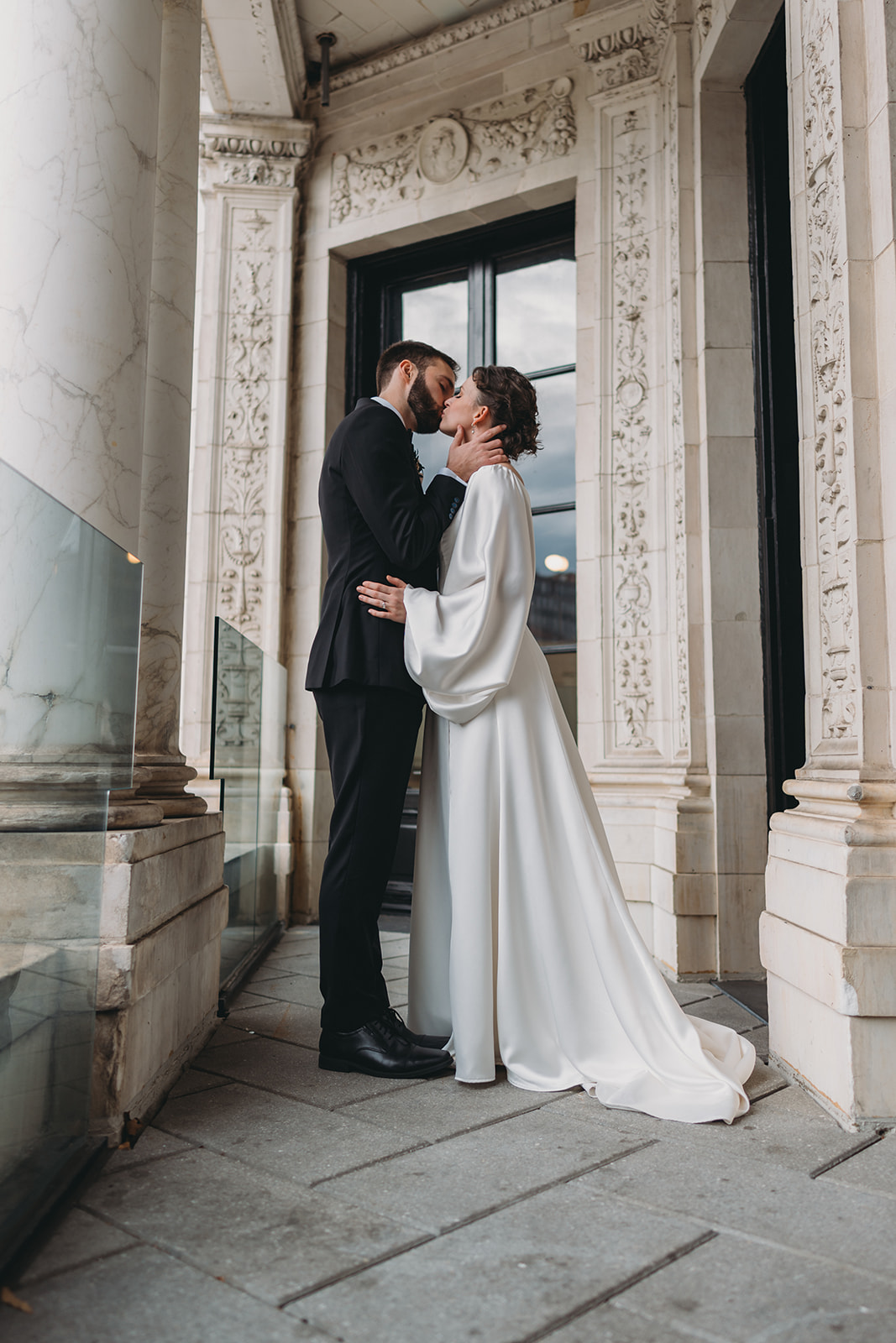bride and groom at Patterson Mansion Wedding share kiss in wide angle portrait, 24mm