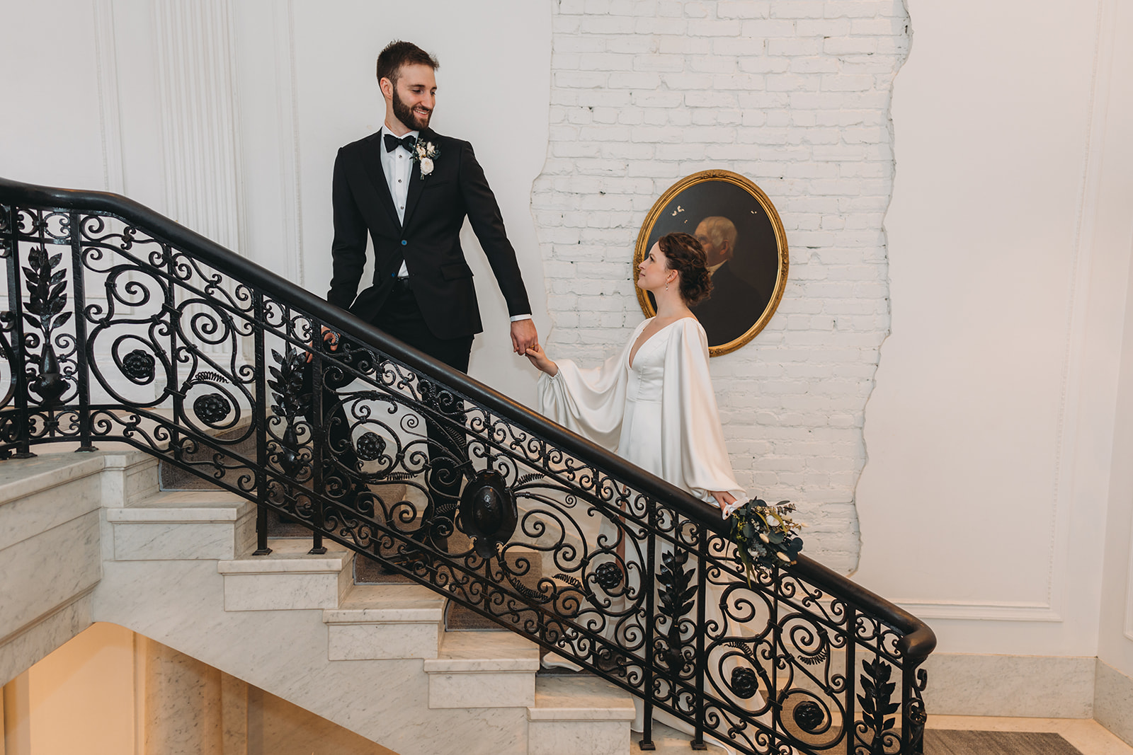 bride and groom at Patterson Mansion Wedding walk up steps in Washington DC