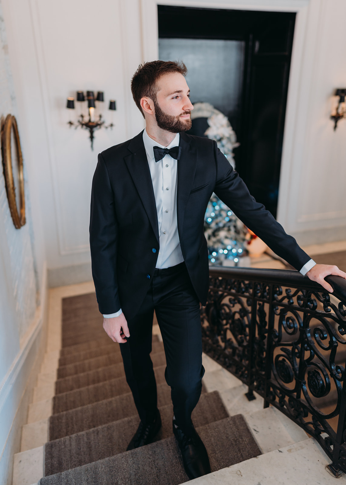 groom on stairwell at Patterson Mansion Wedding in Washington DC