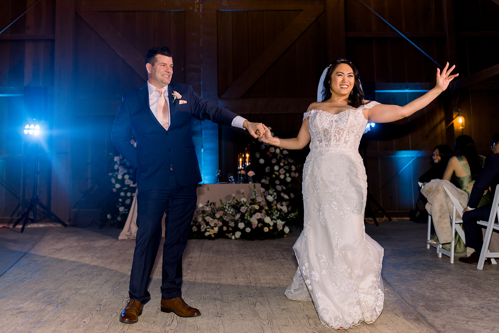 A candid shot captures the infectious laughter of Chris and Rhoda during a joyous moment of their celebration