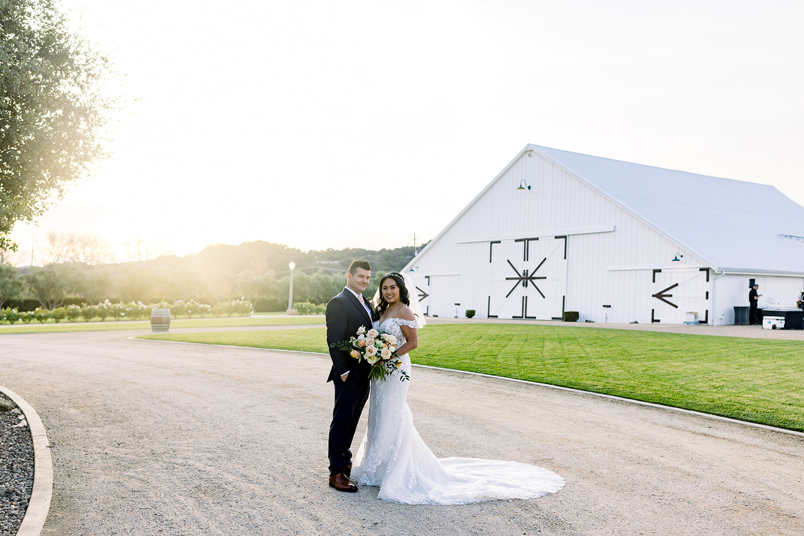 Chris and Rhoda's love story unfolds in the scenic beauty of the White Barn, captured in this heartfelt photograph