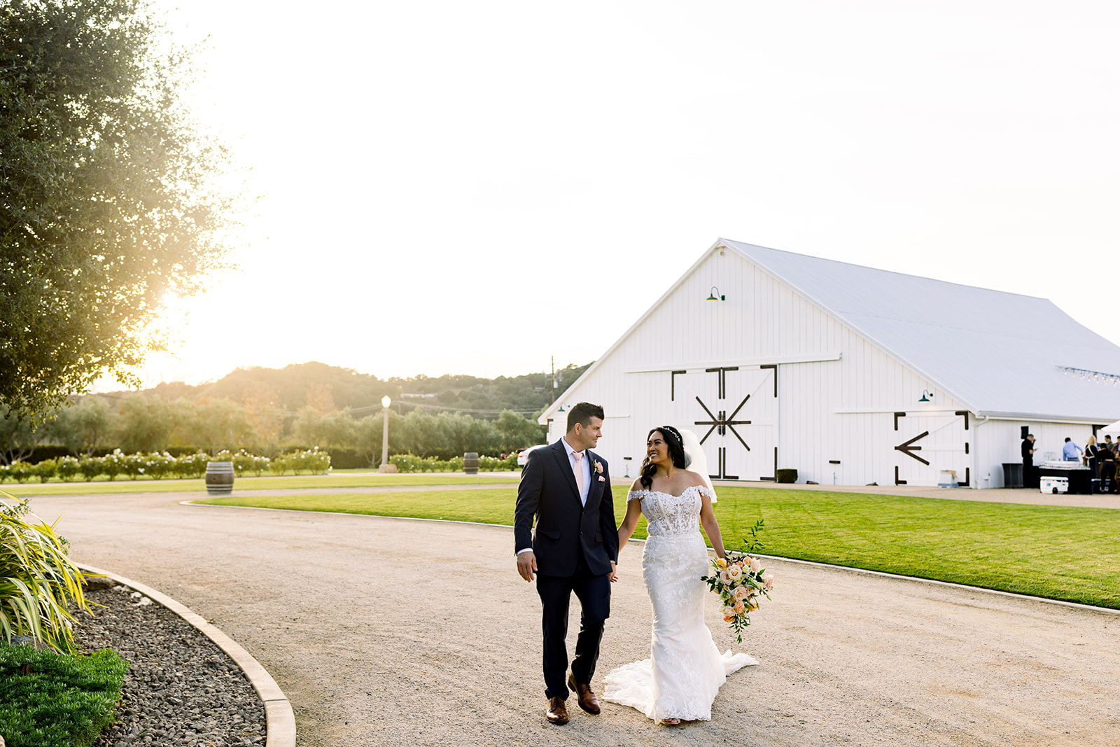 The couple's radiant smiles light up the frame against the picturesque backdrop of the San Luis Obispo landscape