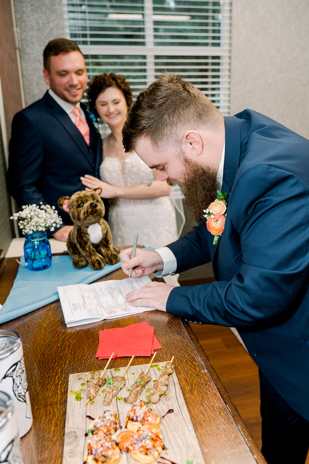 Best man signing marriage license