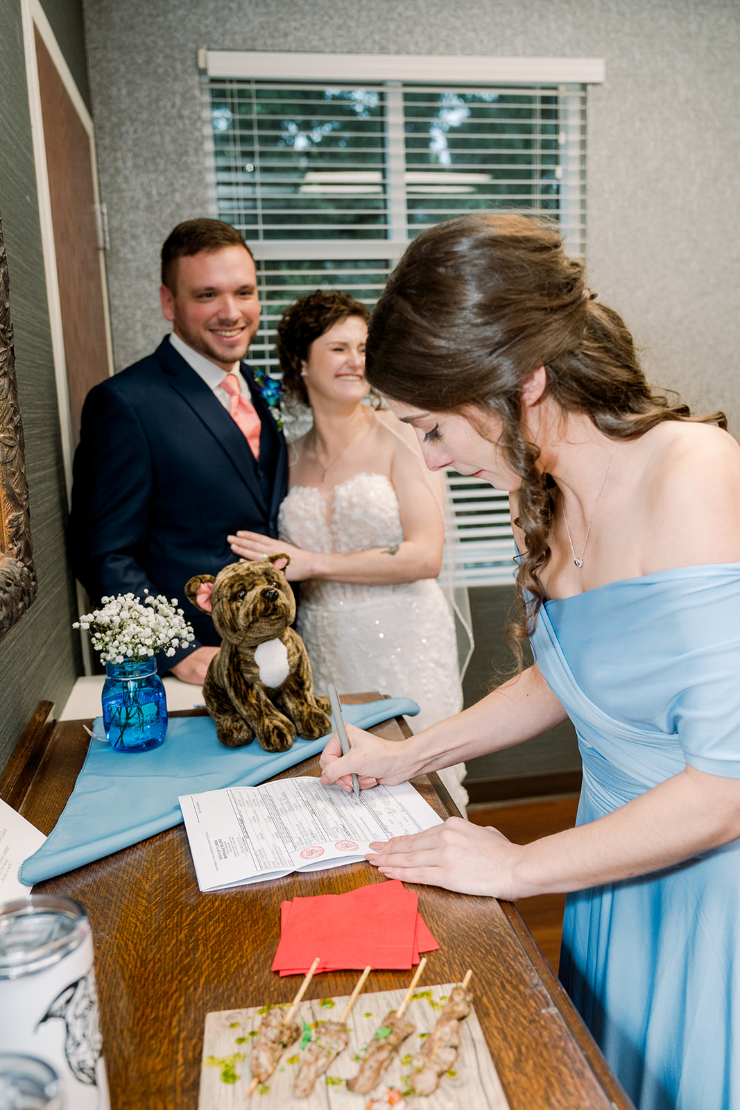 Maid of honor signing marriage license
