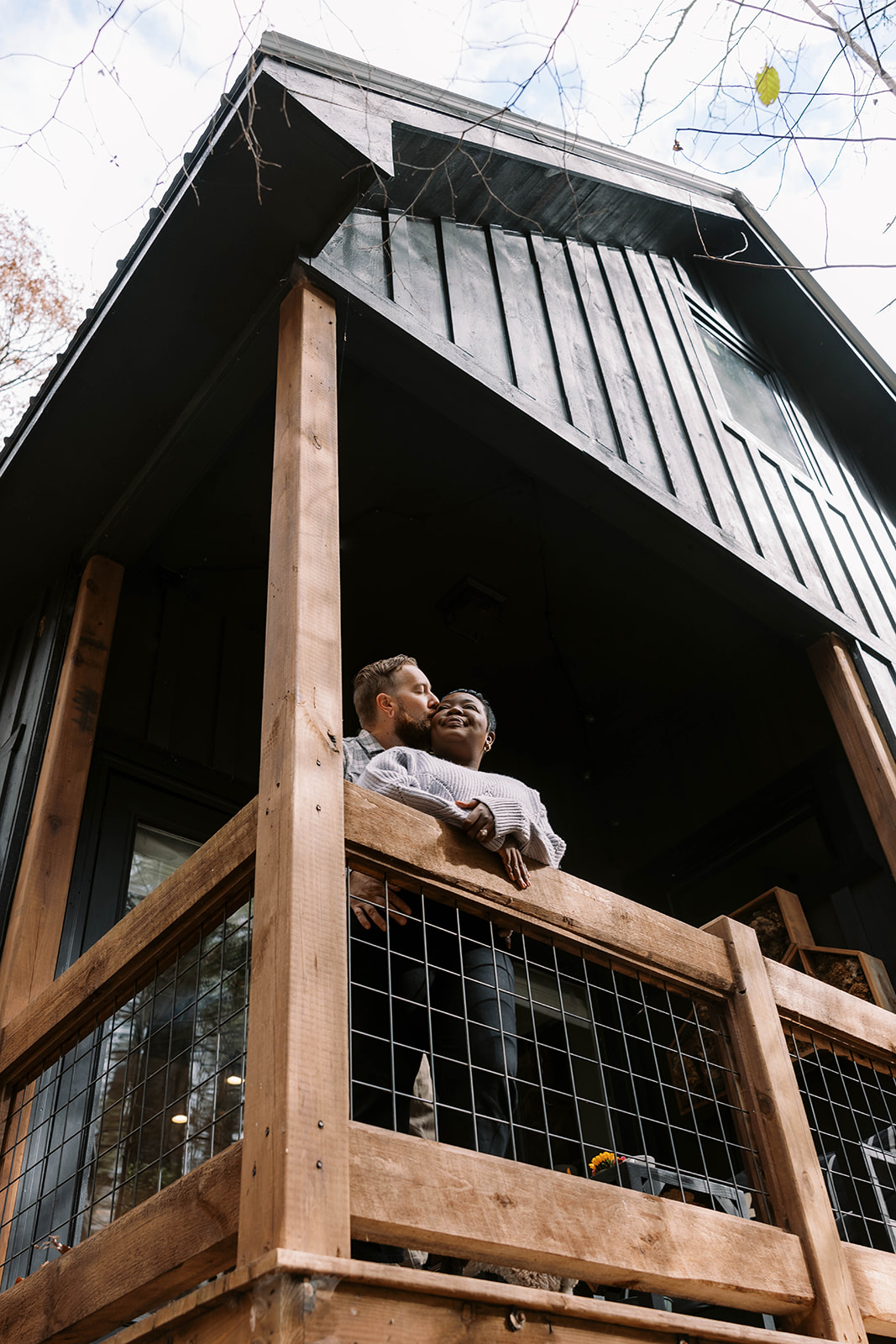 Couple on porch during cabin photoshoot