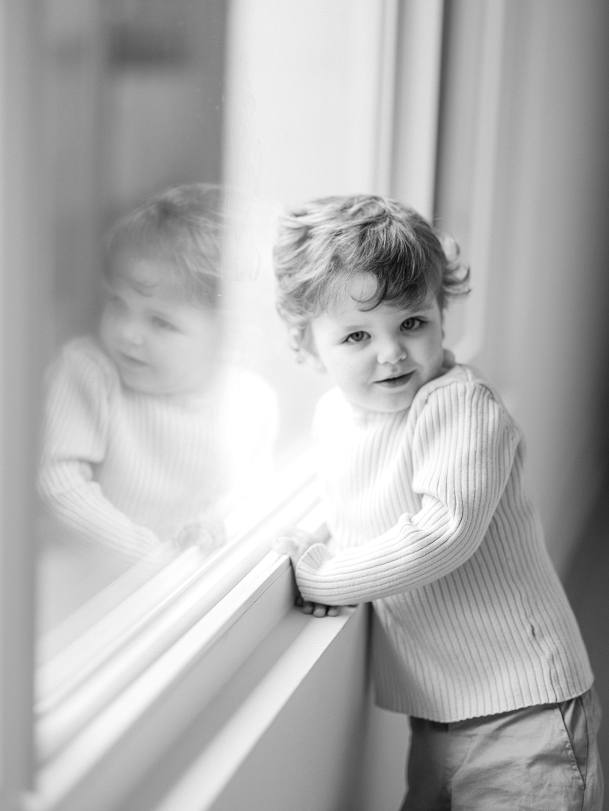 Black and white image of little boy. 