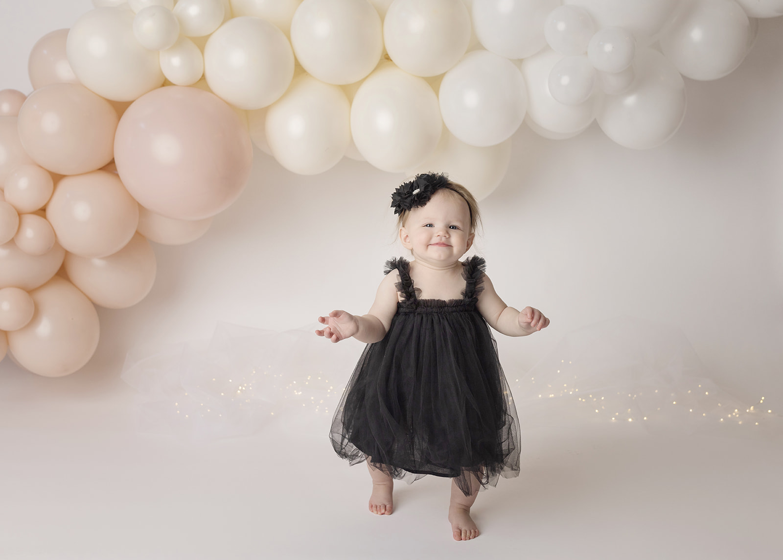 1st birthday girl cake smash photo shoot portrait black dress