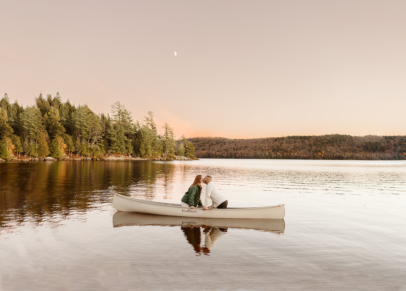 a couple who had their engagement photos done in Algonquin park canoeing 