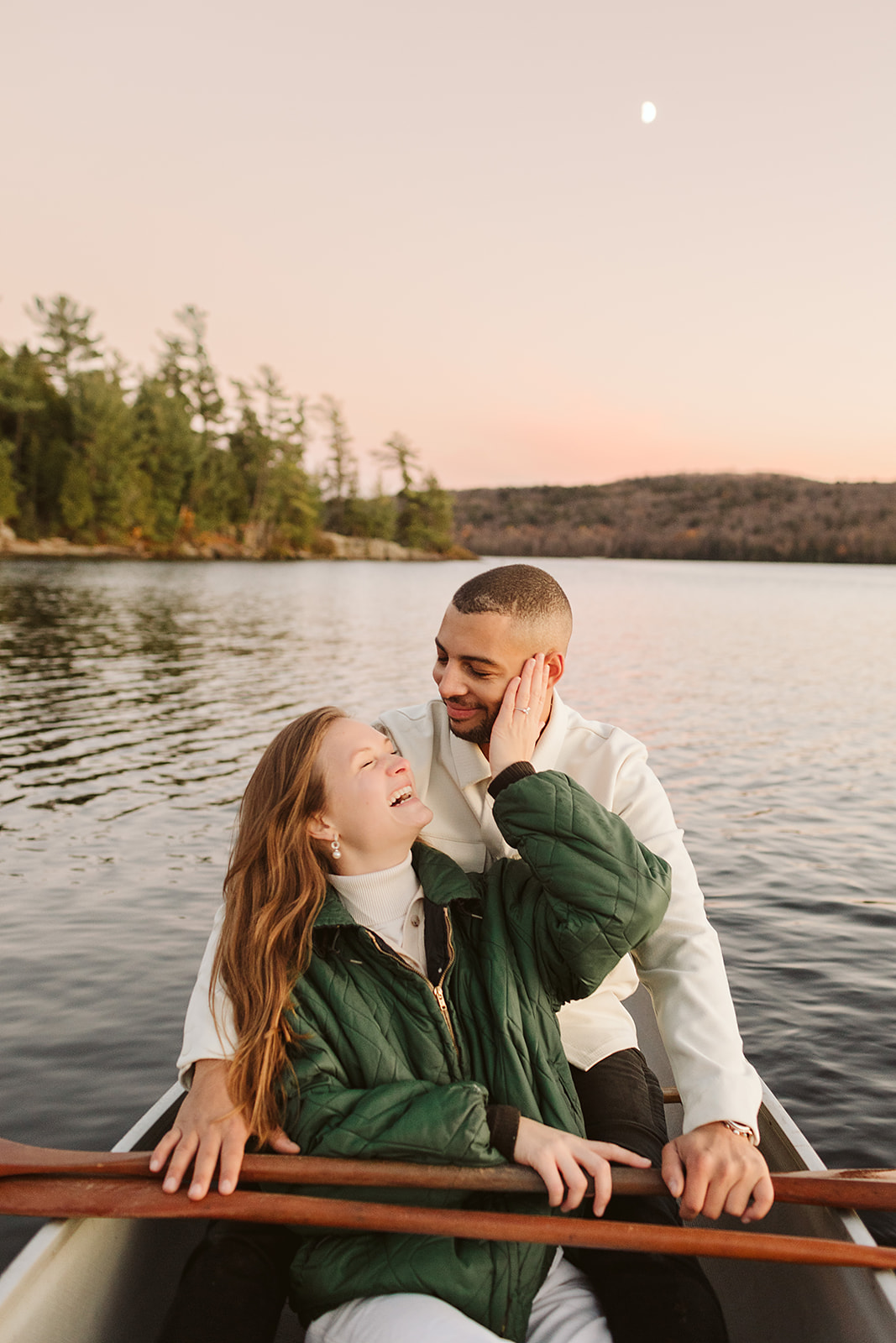 a couple who had their engagement photos done in Algonquin park canoeing 