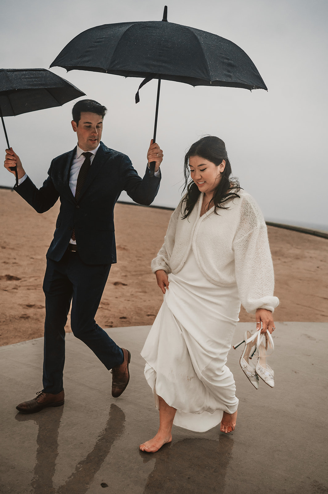 Intimate rainy day Chicago elopement wedding photography - barefoot bride in rain