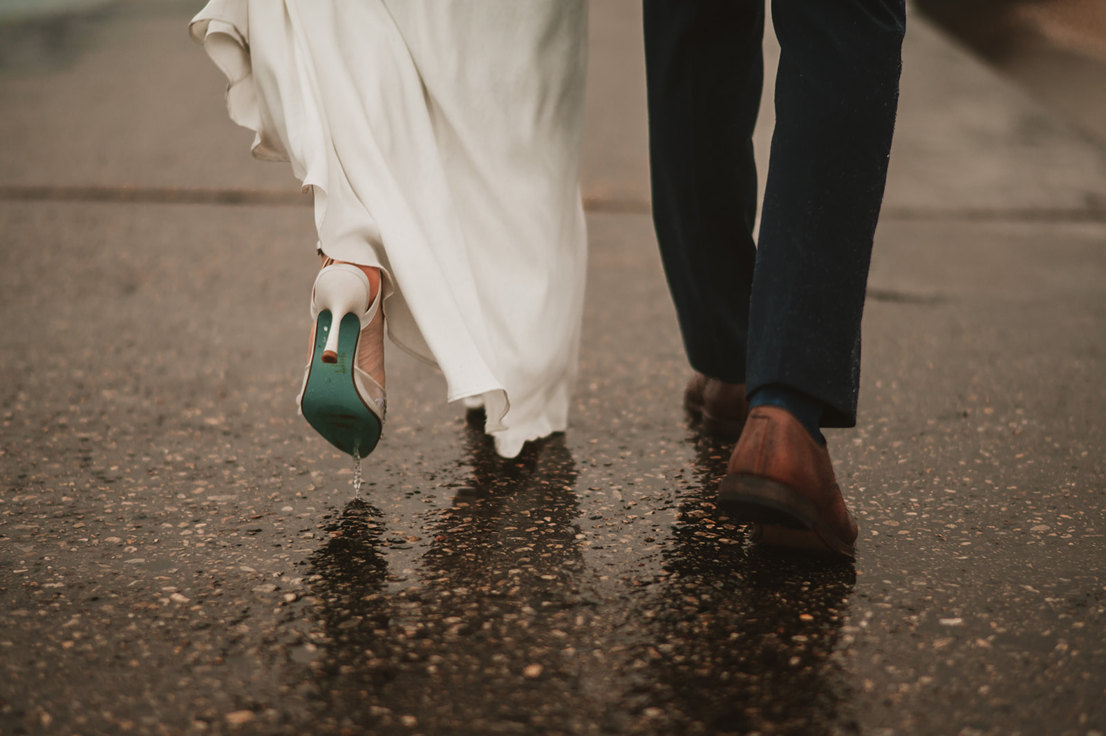 Intimate rainy day Chicago elopement wedding photography - Skyline over lake Michigan, feet walking