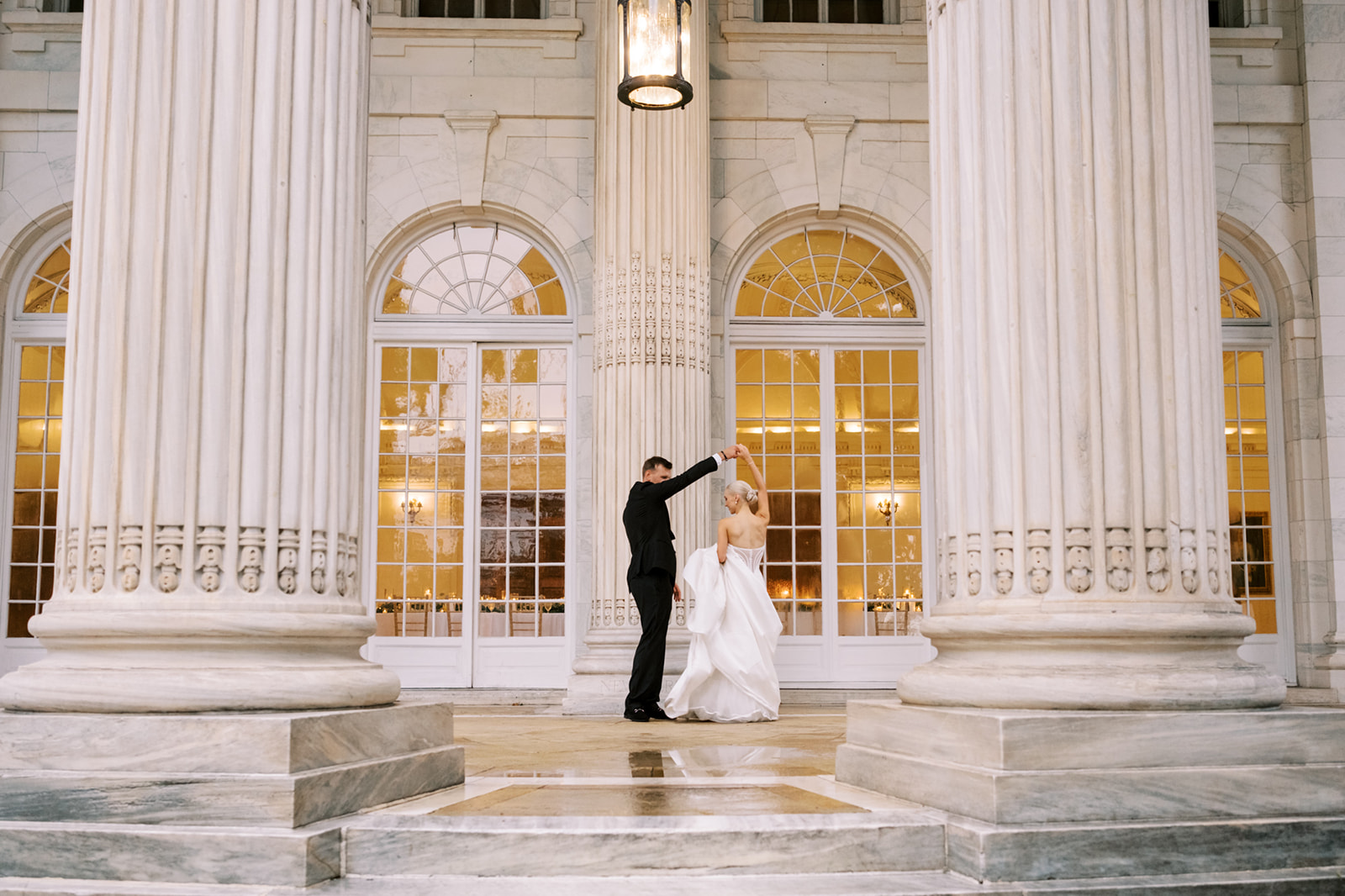 Bride and groom dancing on the portico at DAR in Washington DC