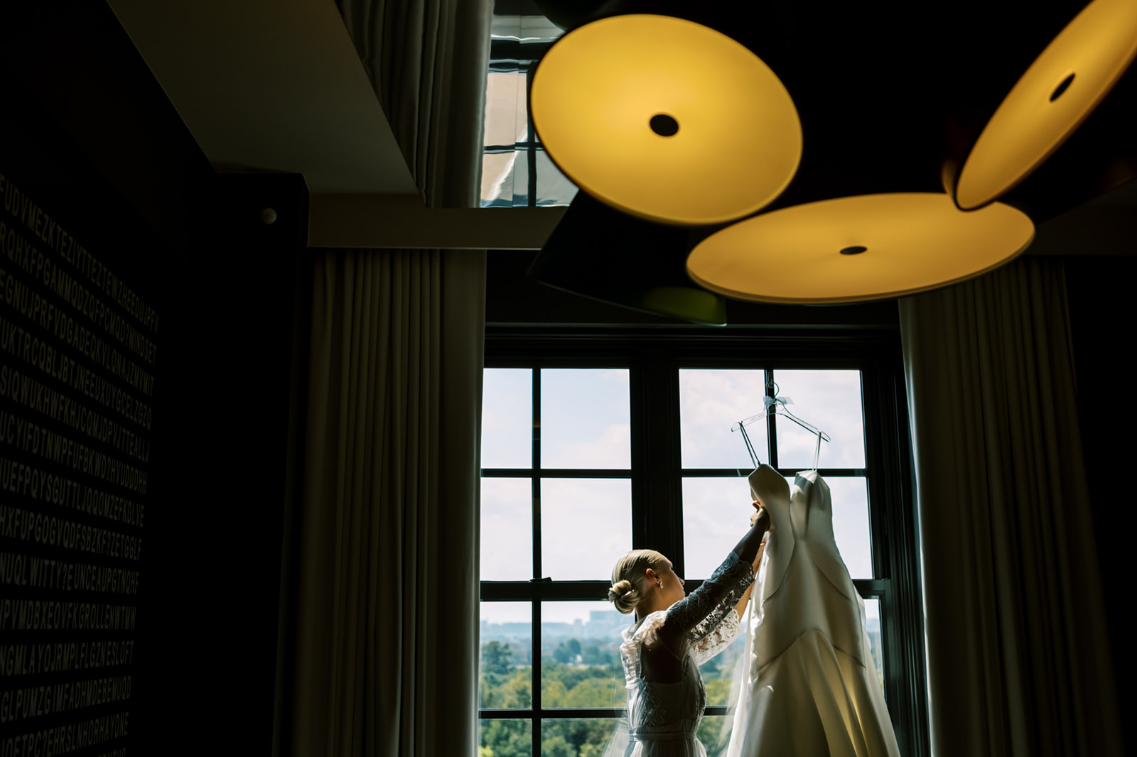 Bride hanging dress at the Hotel Washington