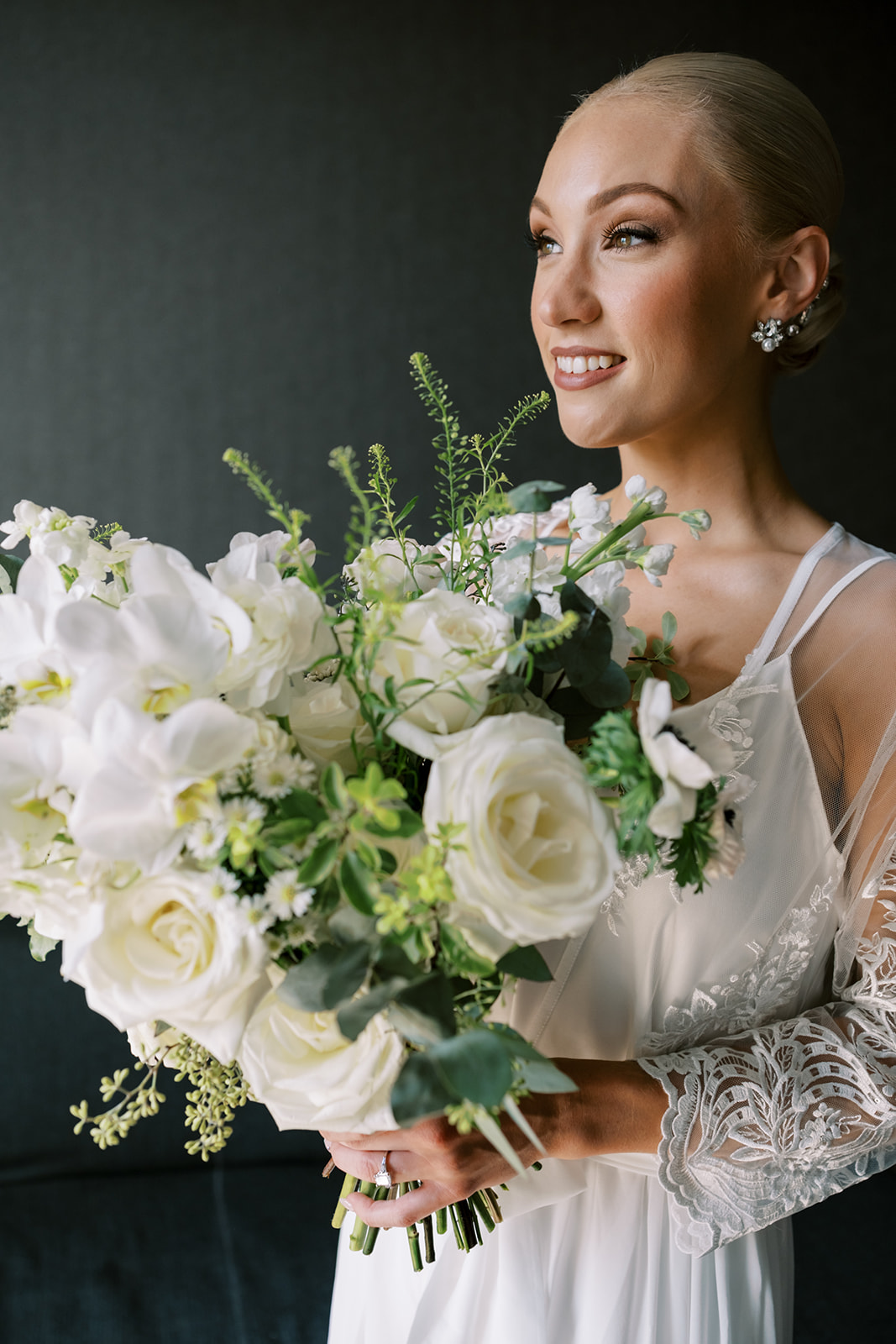 Bride holds her beautiful bouquet from Nana Floral Event