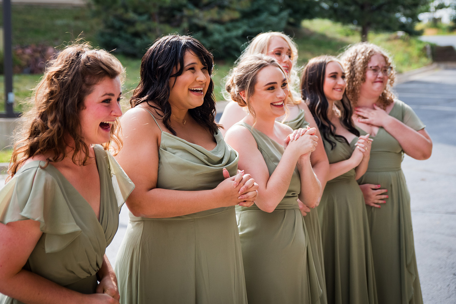 The bridesmaids react emotionally during the bride and bridesmaid first look.