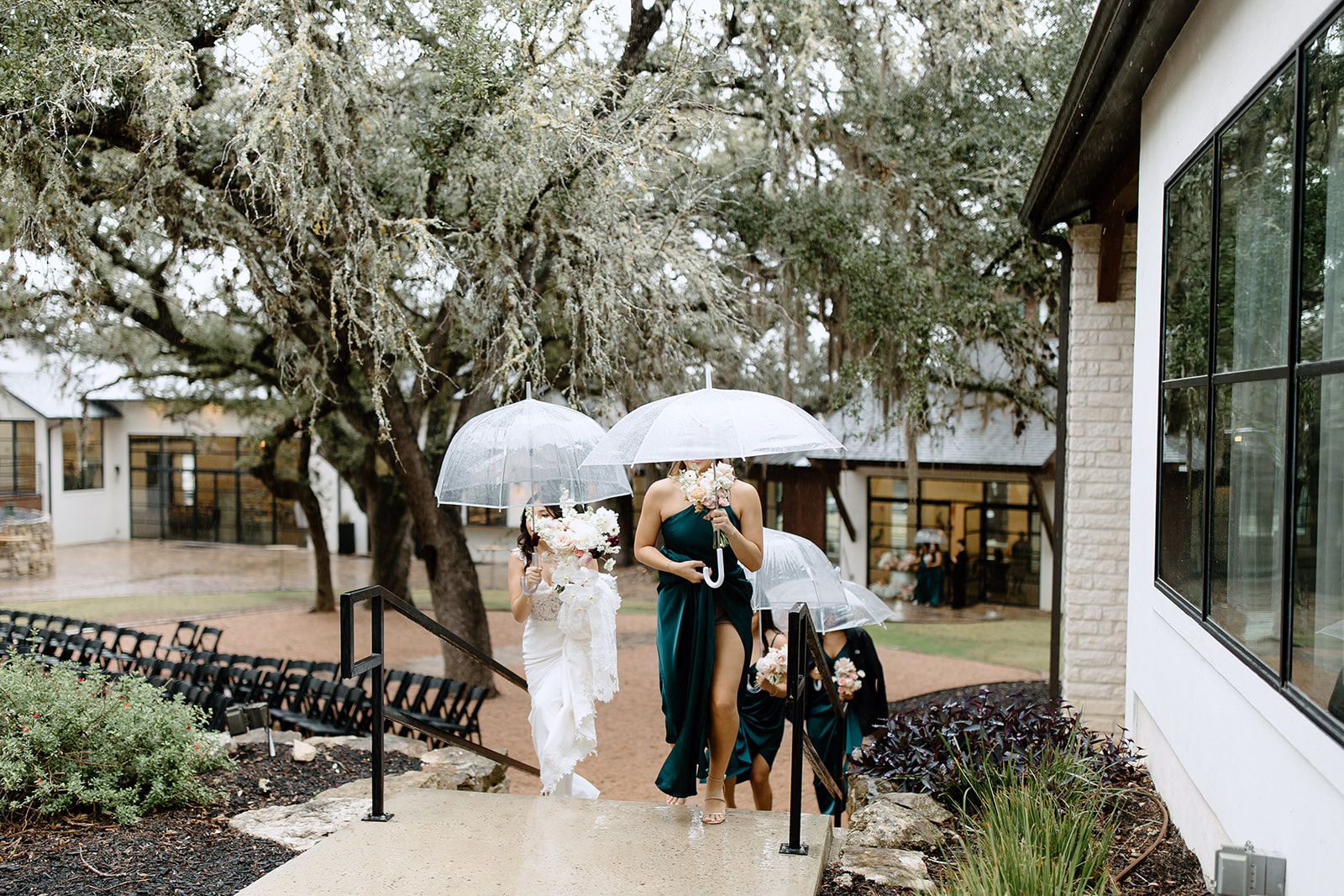 Bride and bridesmaids with umbrellas