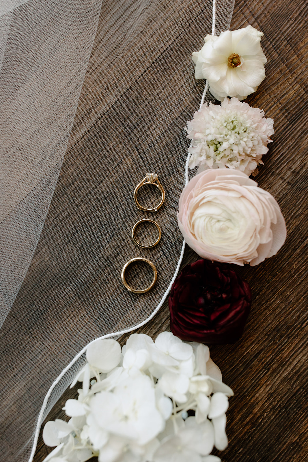 Flat lay of jewelry, shoes, and florals