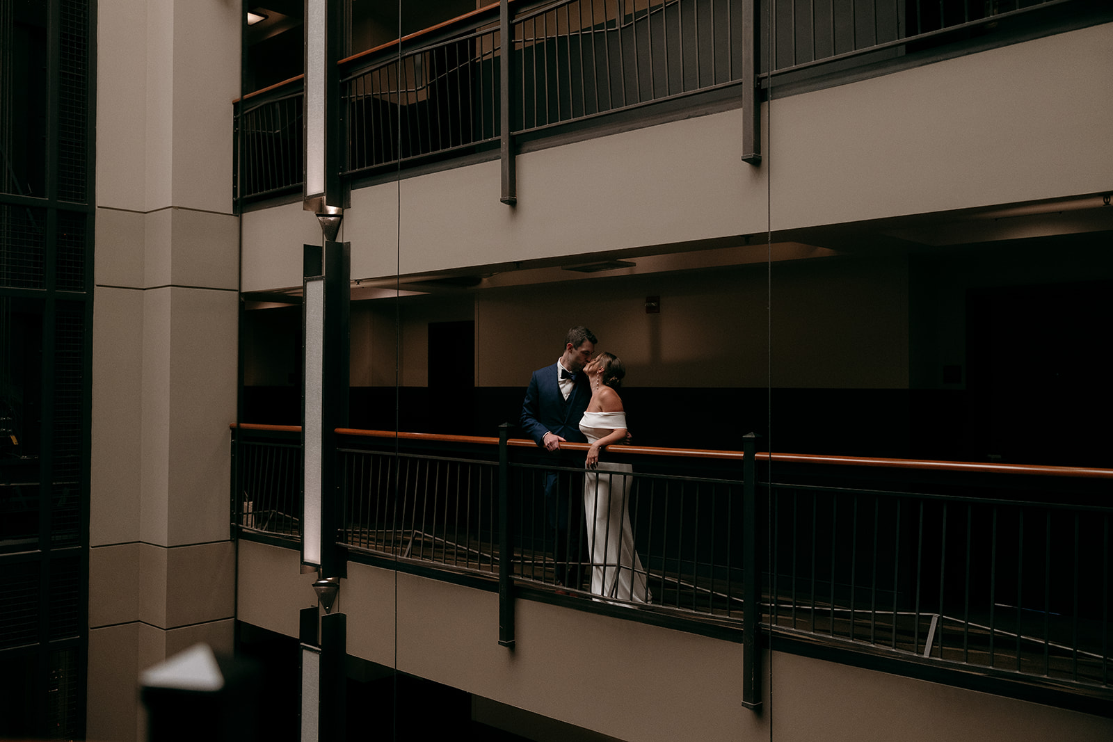 A bride and groom share a kiss on their wedding day at the Roxy Hotel in NYC