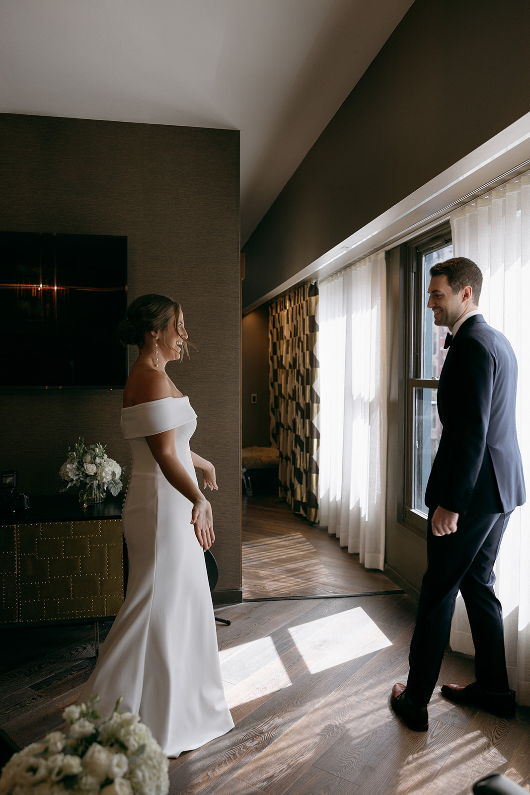 A bride and groom have their first look at The Roxy Hotel