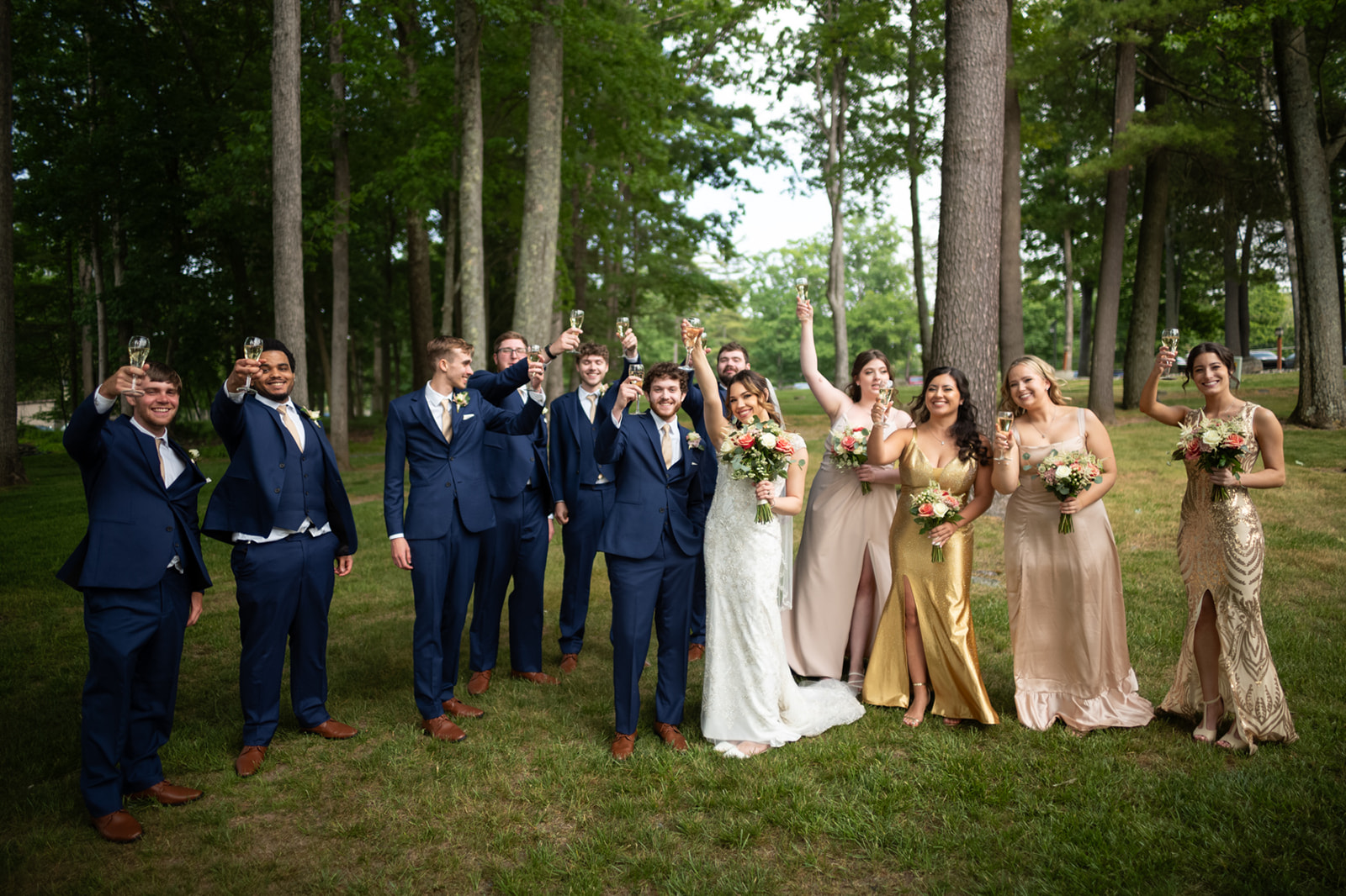 Panoramic view of a serene wedding party in the lush Poconos, showcasing nature's beauty as a backdrop.