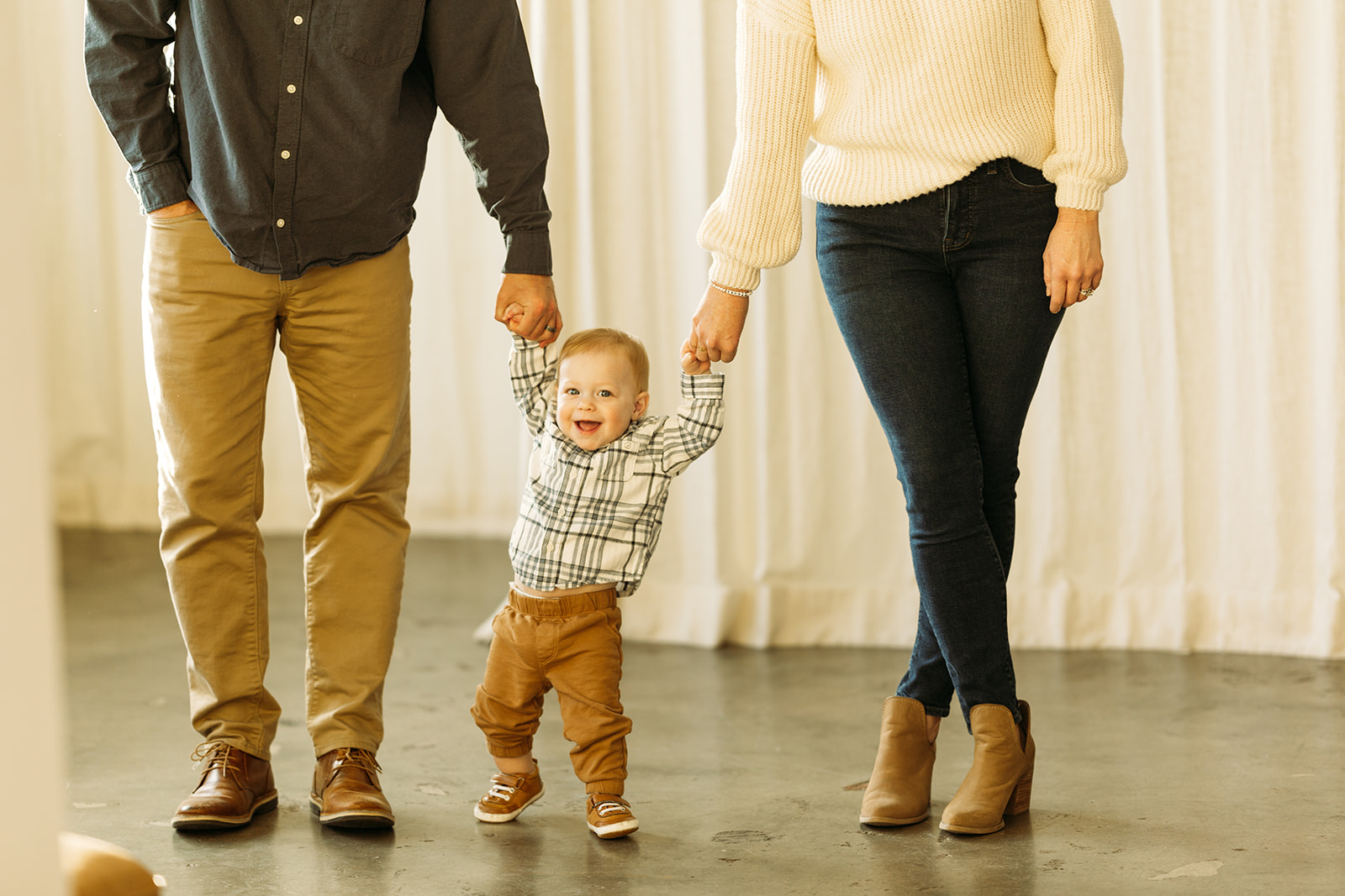 studio family photos with warm neutral outfit tones, small family with baby in denver colorado, family photography inspo