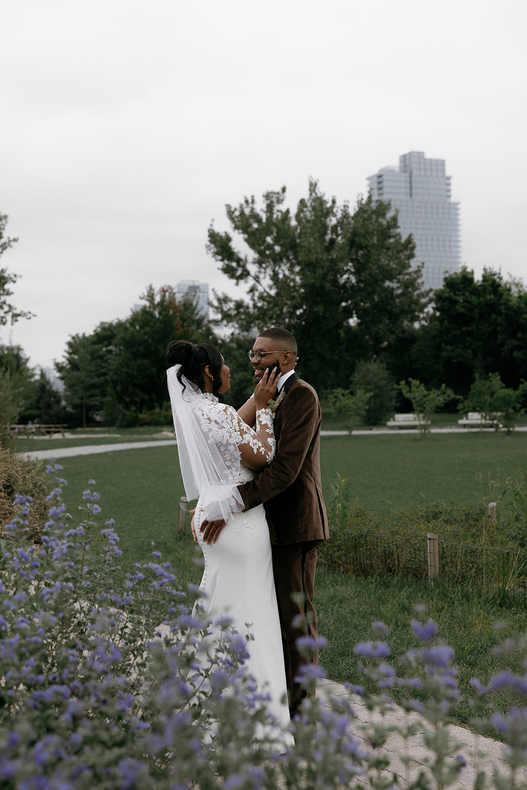 A bride and groom take pictures at Marsha P. Johnson State Park in Brooklyn
