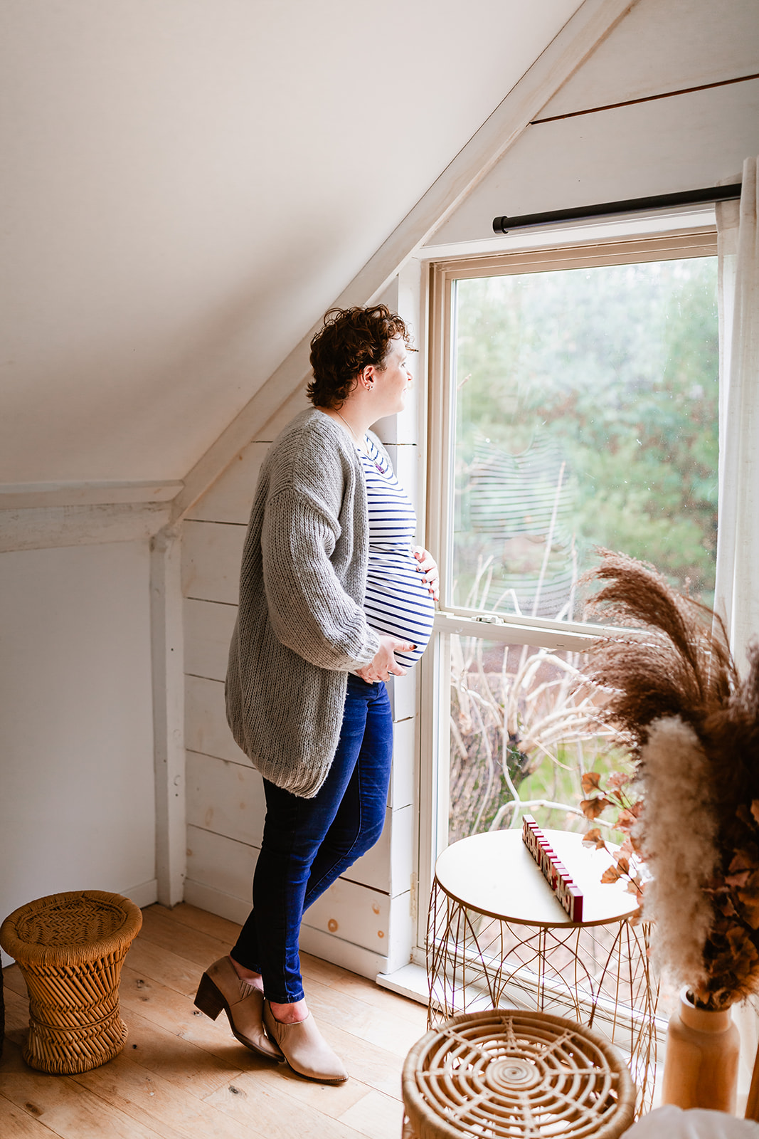 maternity photos in a warm, bright modern farmhouse loft
