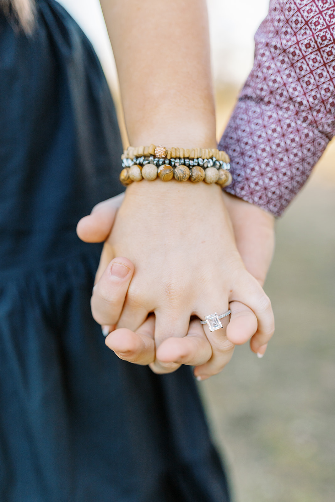 close up of hands and ring during an engagement session in College Station