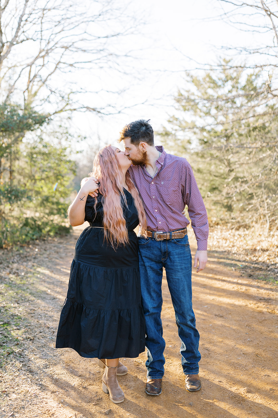 couple kissing during their engagement session in College Station