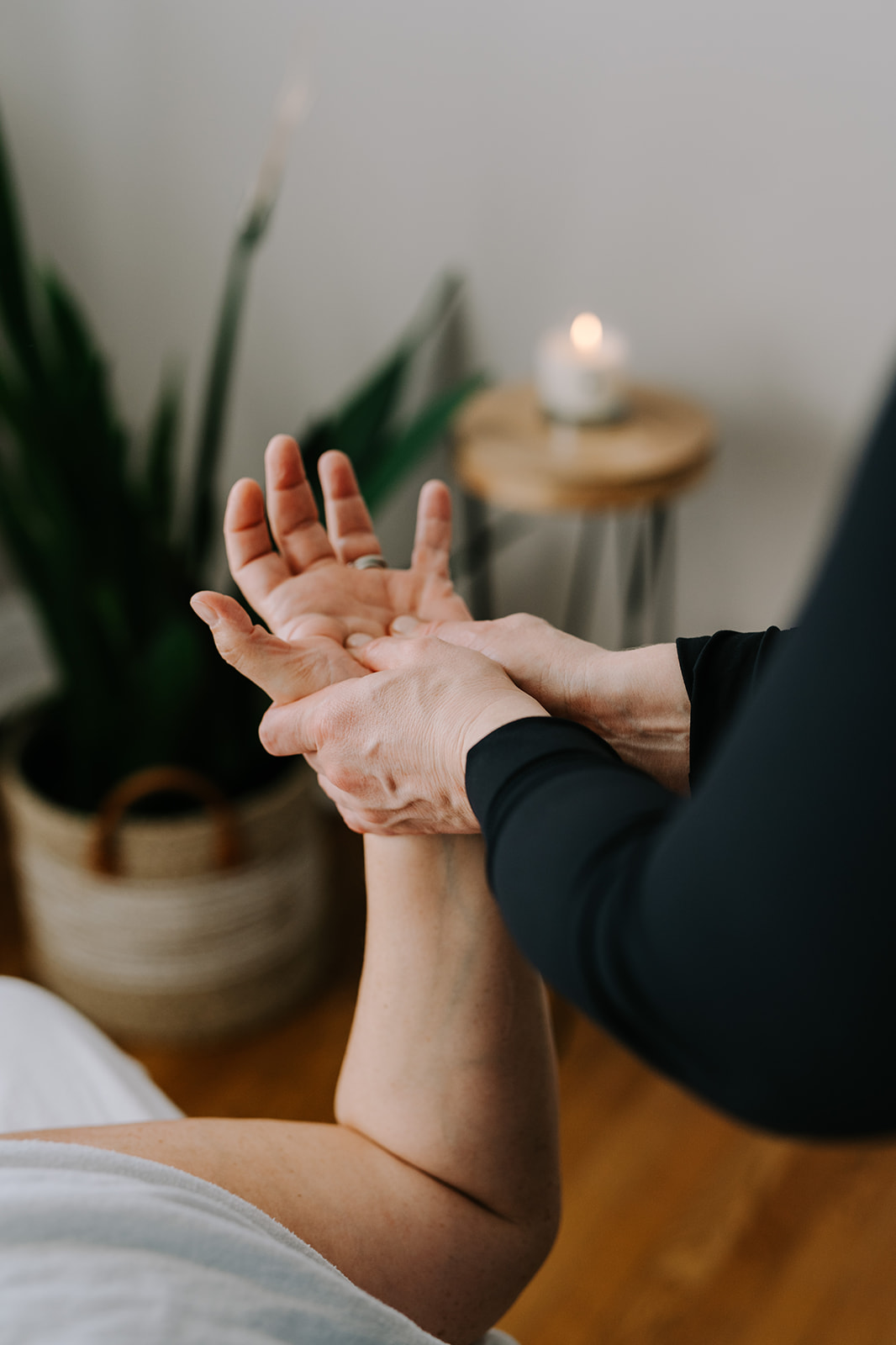 massage therapist giving a hand massage