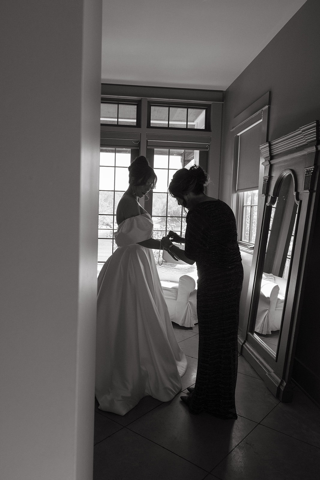 Bride gets ready with mom in bridal suite at The Barn at Smith Lake on wedding day in Alabama