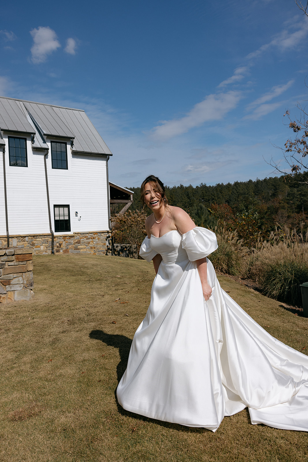 Bride walks in her wedding dress at The Barn at Smith Lake in Alabama