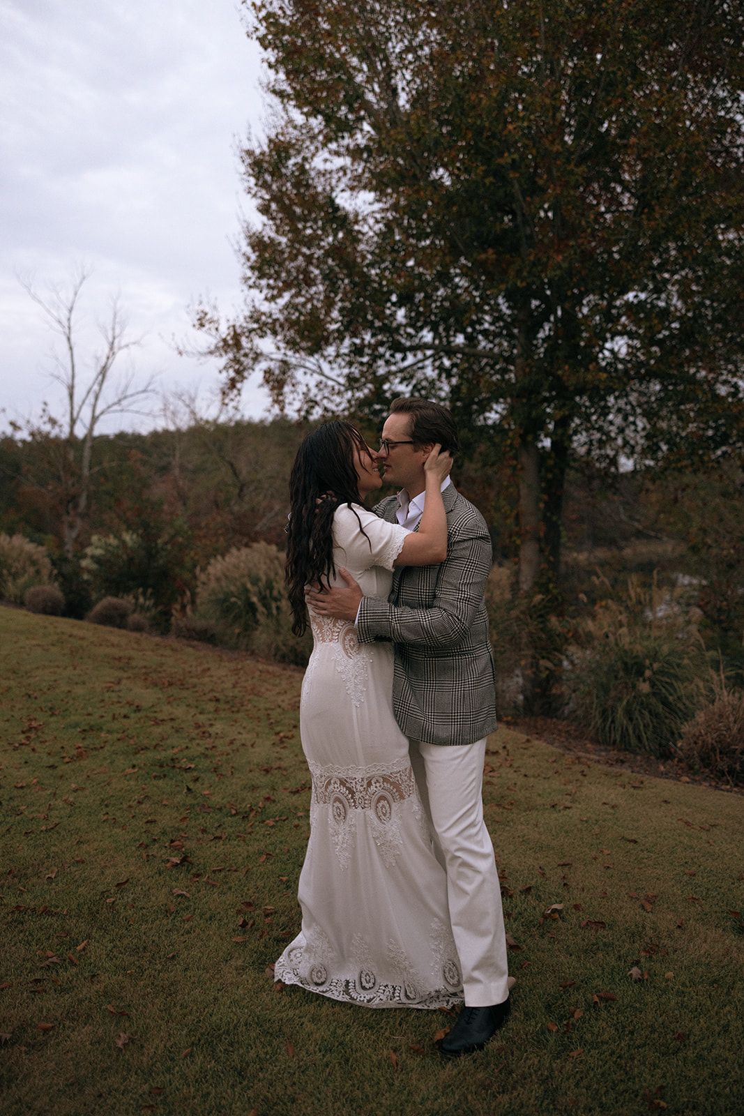 A couple holds each other at their welcome party in Alabama at the Barn at Smith Lake