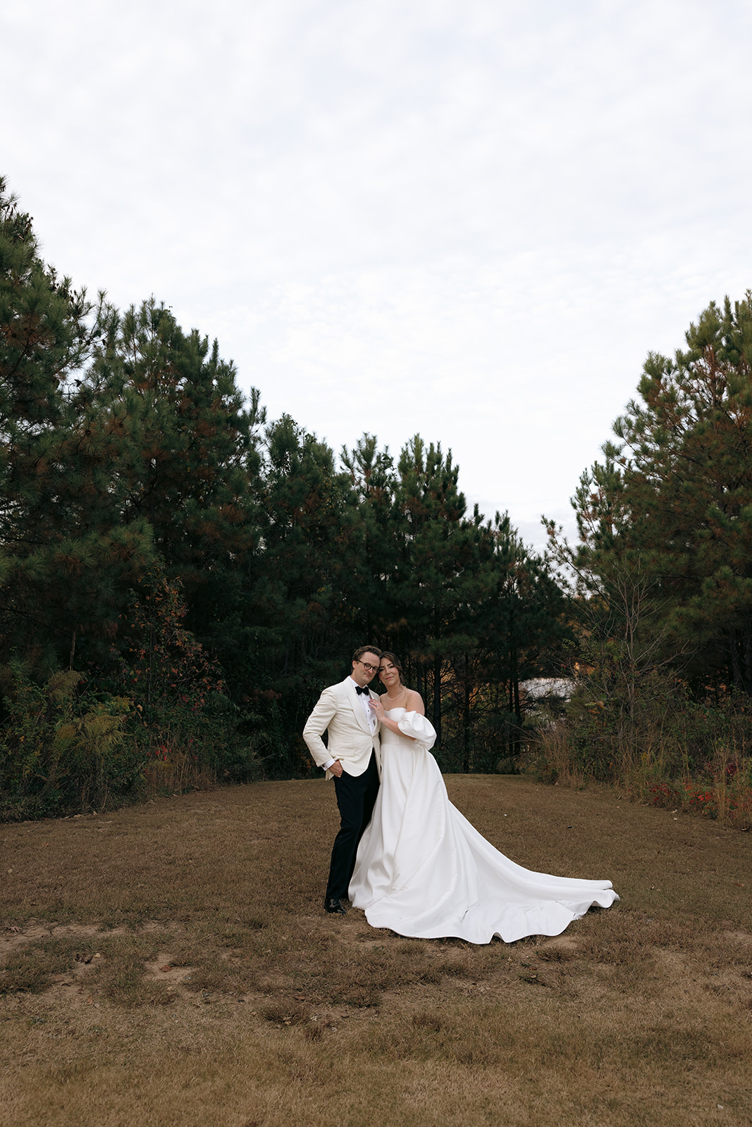 A couple takes wedding portraits at The Barn at Smith Lake in Alabama