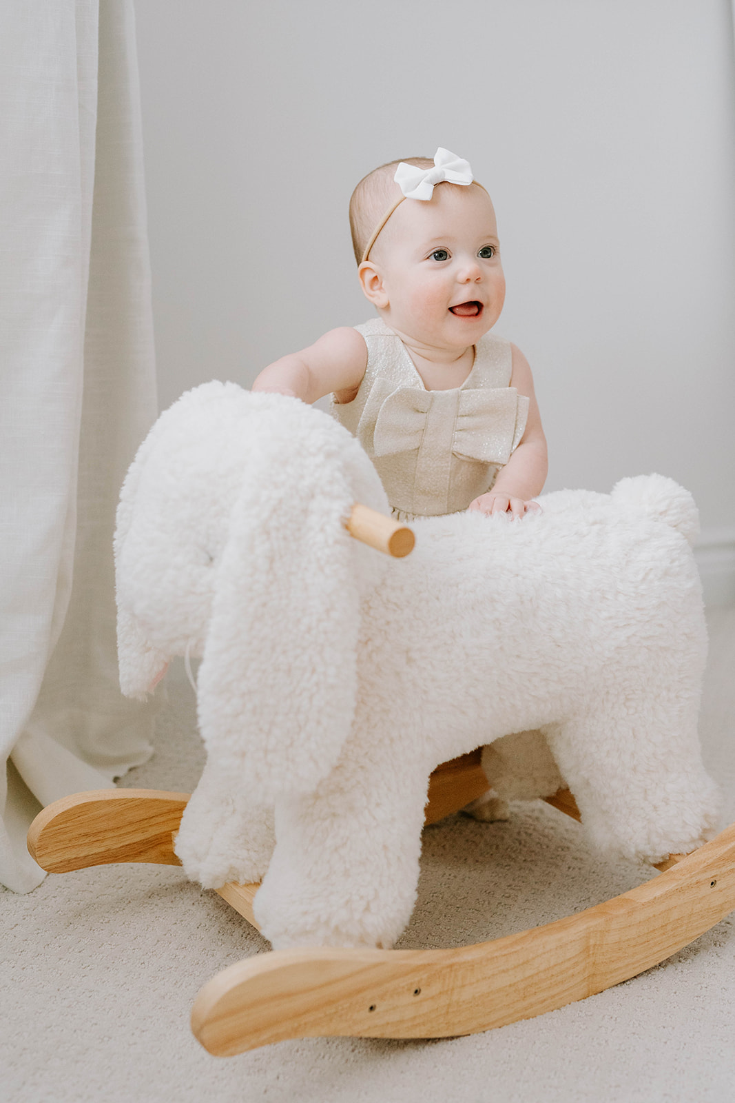 baby girl with rocking horse