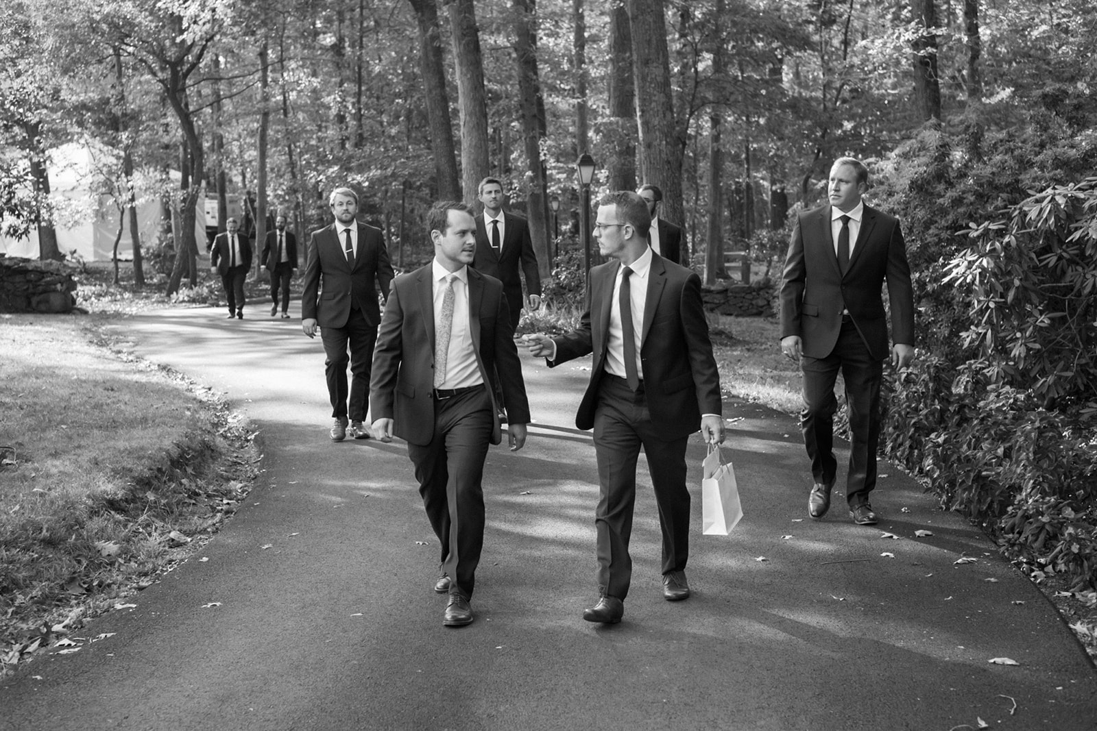 Groomsmen walking to wedding at Goodstone