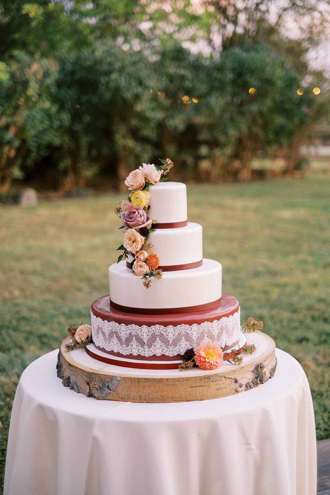 Wedding cake in a field at Goodstone Inn wedding