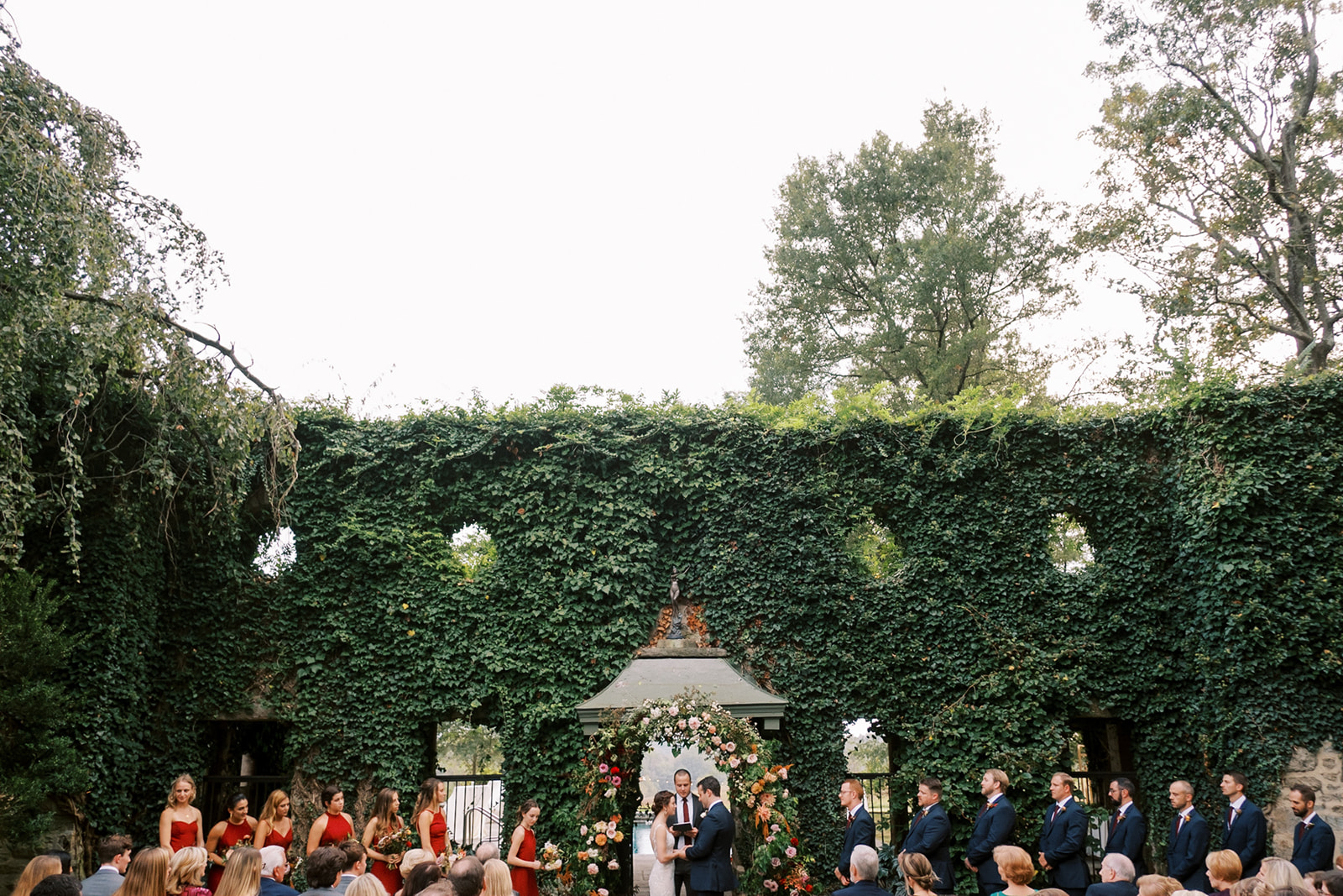 wedding party lined up in front of the ivy wall at Goodstone wedding