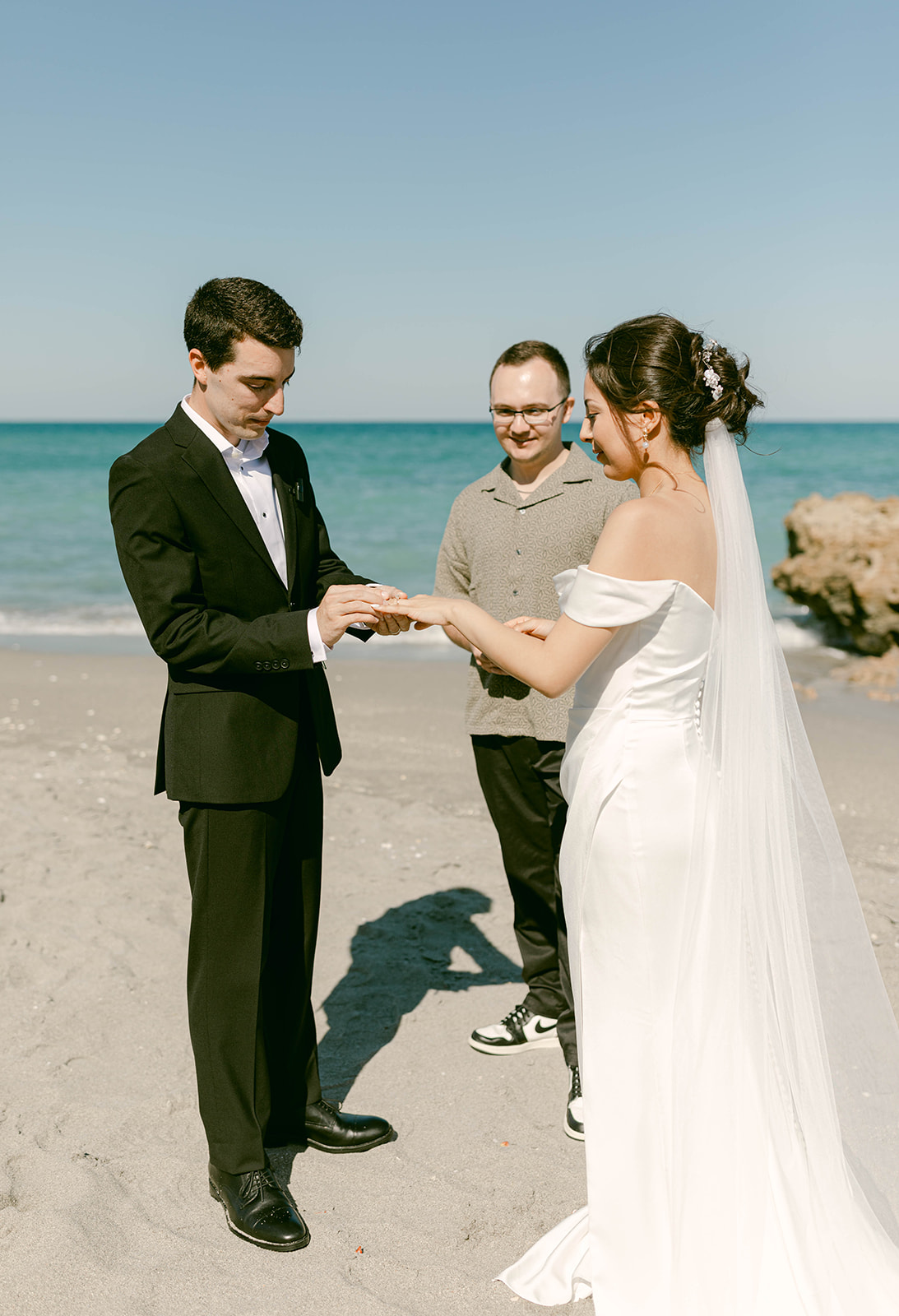 Bride and Groom exchange rings in intimate Palm Beach, Florida ceremony