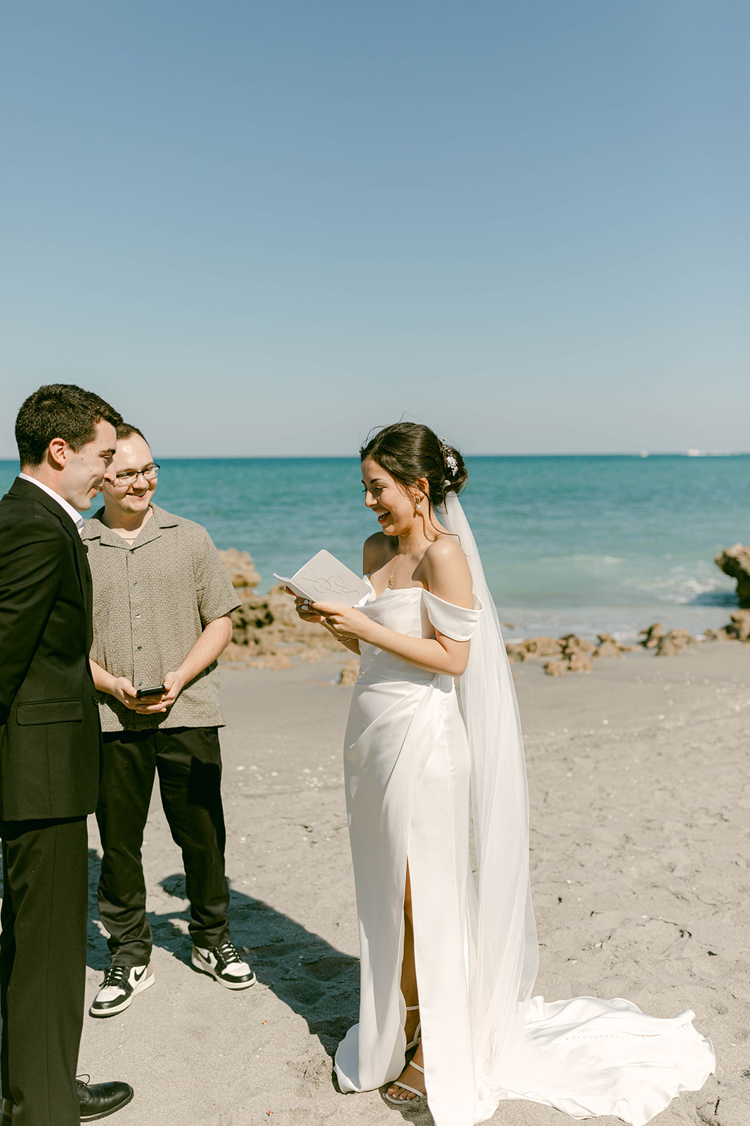 Bride reads vows to groom at intimate wedding ceremony in Palm Beach, Florida