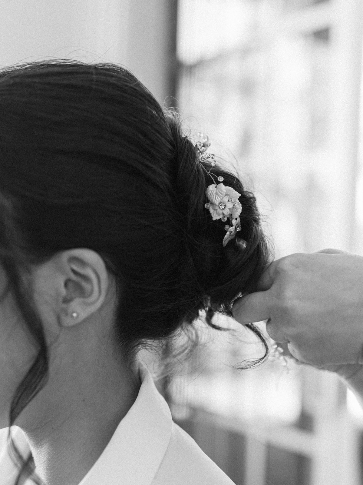Bride showcases something borrowed hair piece prior to her intimate wedding ceremony in Palm Beach, Florida