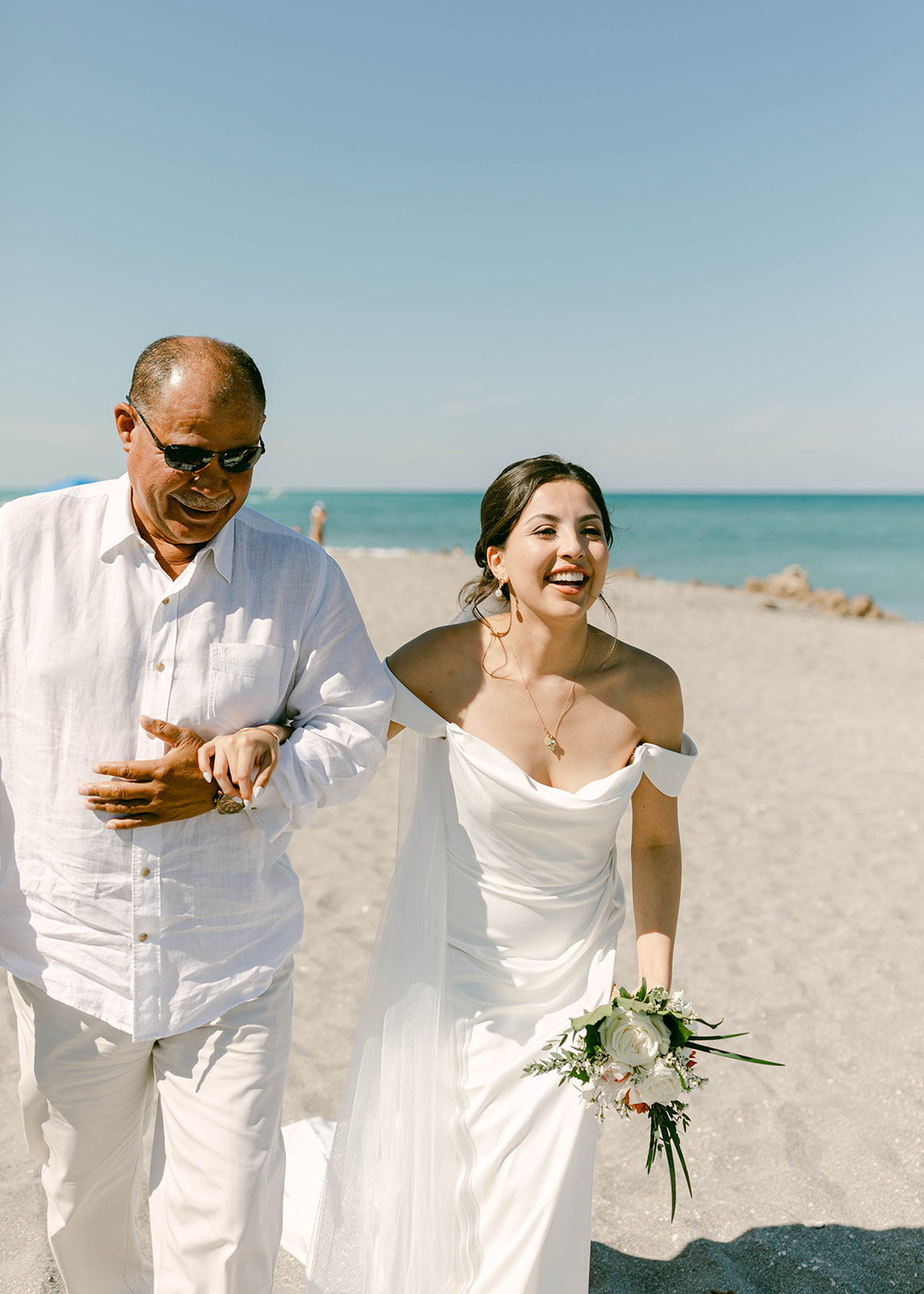 Father of the bride walks Bride down the aisle at beach ceremony in Palm Beach, Florida