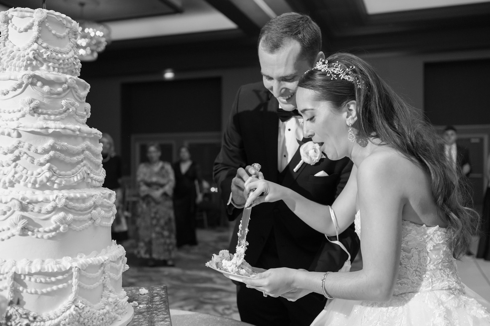 Bride and groom cut epic cake at Lansdowne Resort wedding