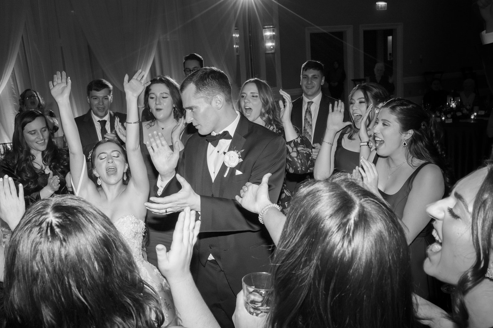 Bride and groom surrounded by friends on the dance floor at lansdowne resort wedding