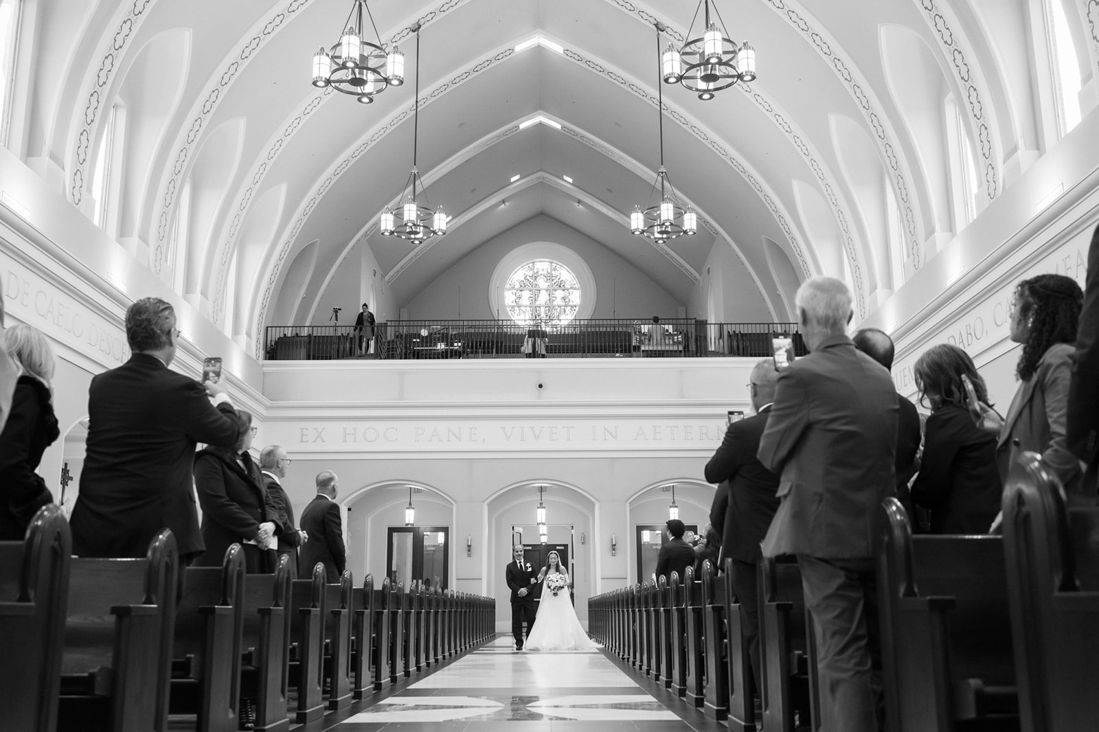 Bride walks down the aisle at St John the Apostle Catholic Church in Leesburg