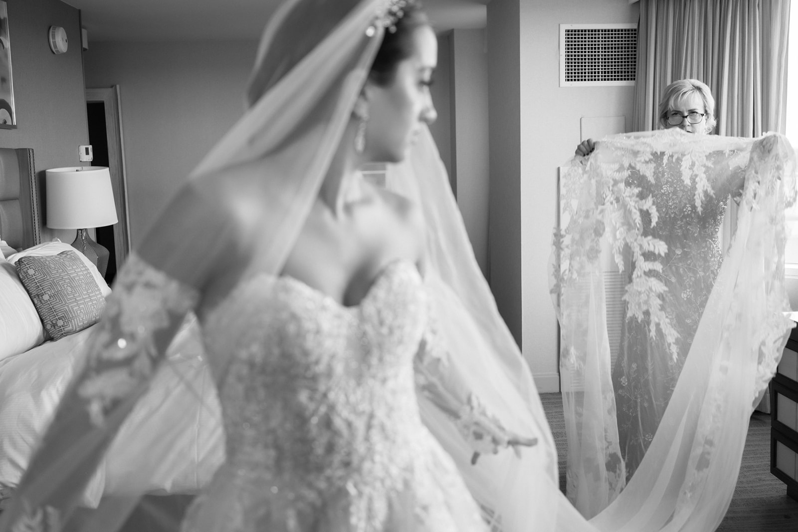 Bride's Mom fluffs wedding dress at Lansdowne as she finishes getting ready