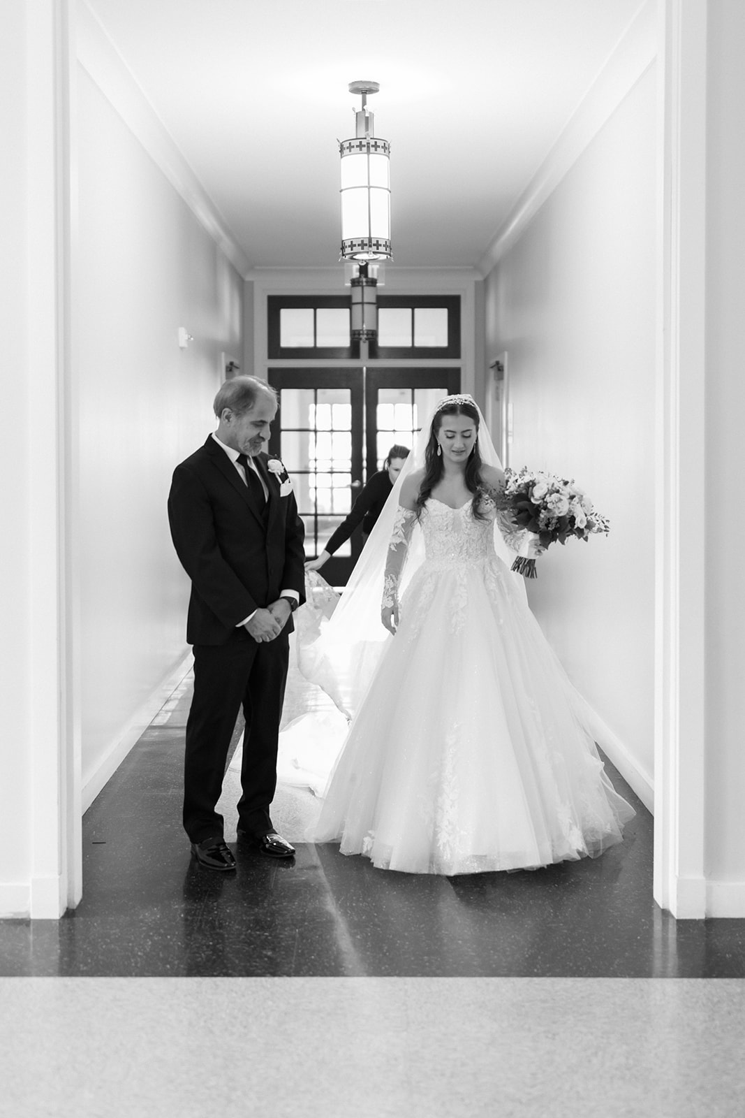 Father and daughter stand ready just before walking down the aisle at St John's Leesburg Catholic wedding