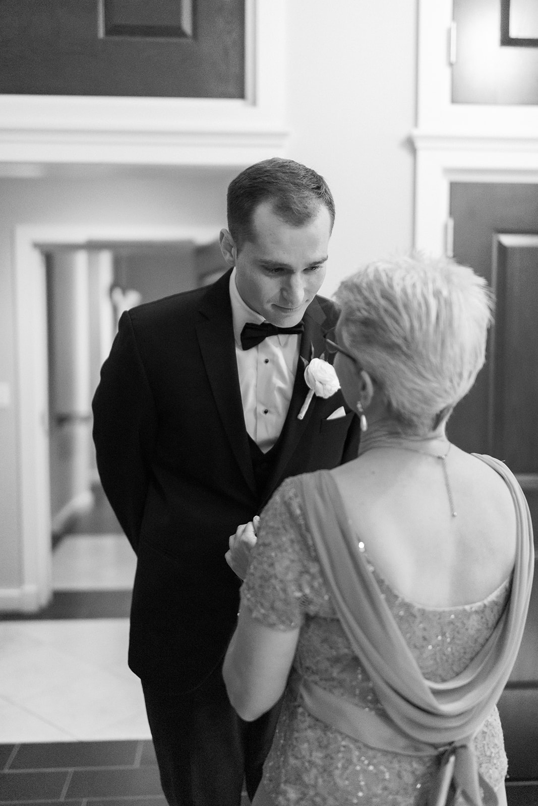 Groom talks to his mother right before wedding ceremony begins at St John's Leesburg