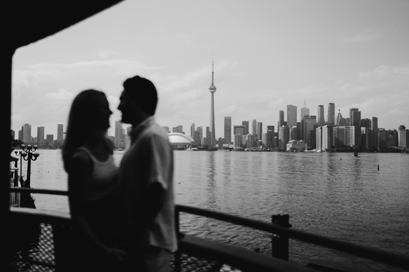 CN tower in the background during and engagement session on Toronto Island 