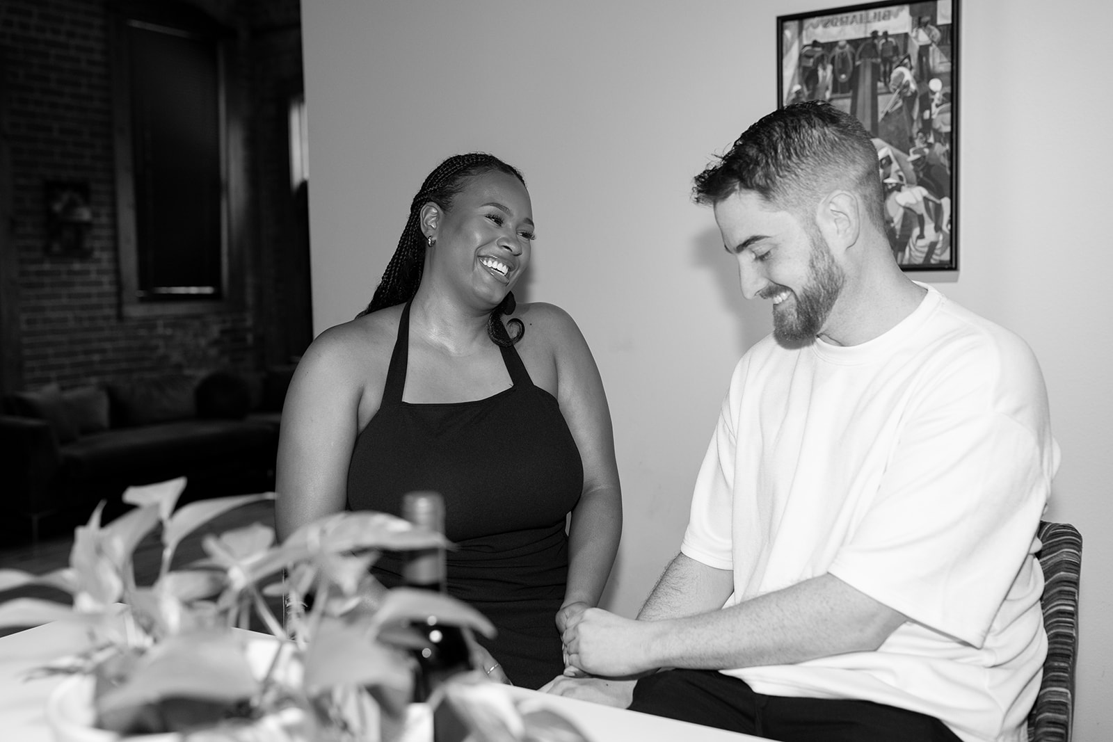couple in kitchen of their apartment during engagement session